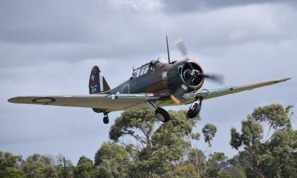 A CAC Wirraway retracts its landing gear after takeoff